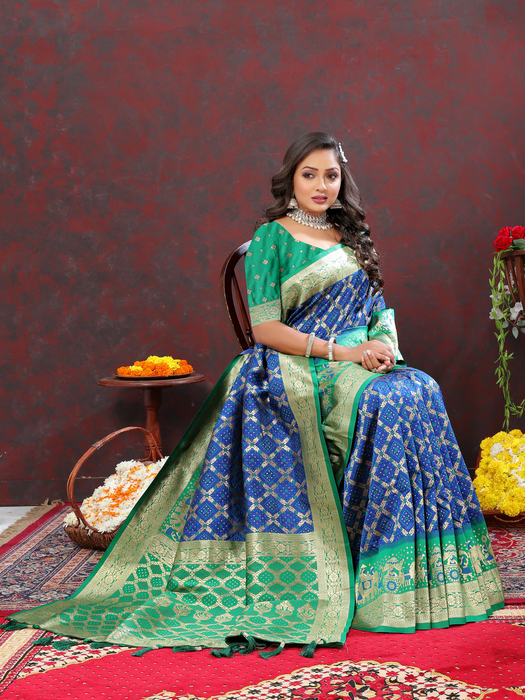 Timeless blue silk saree adorned with Meenakari motifs and a zari border, ideal for weddings and special events.