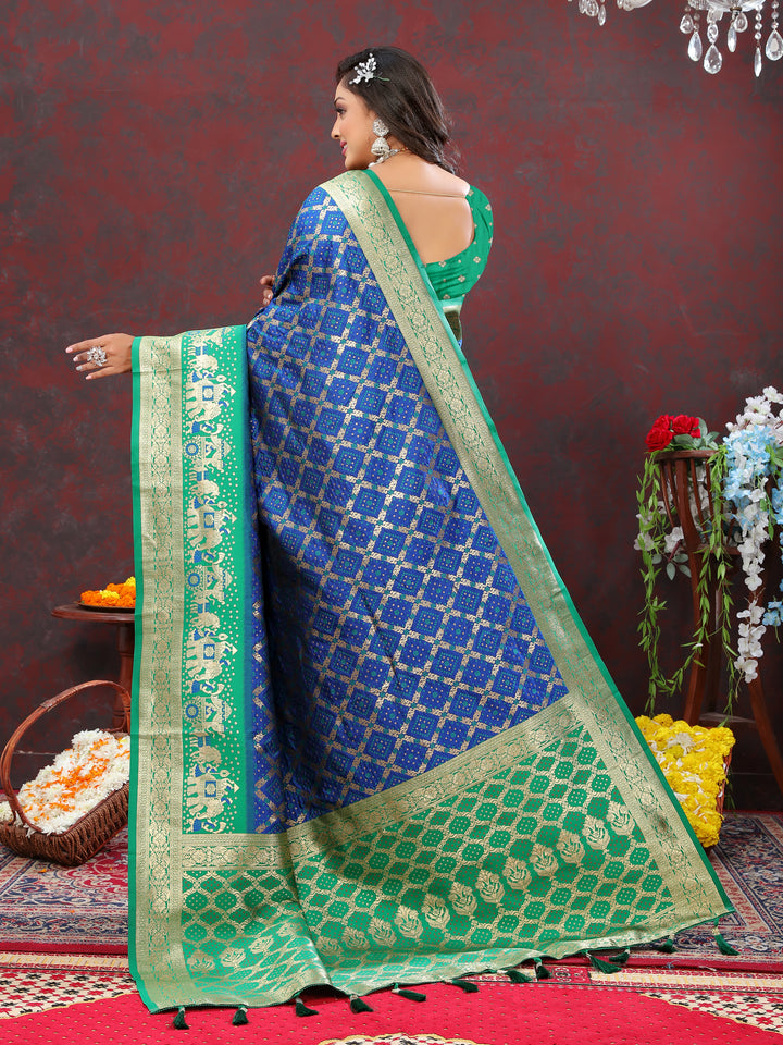 Blue silk saree with Meenakari weaving and a contrasting zari border, designed to make a statement at weddings and functions.