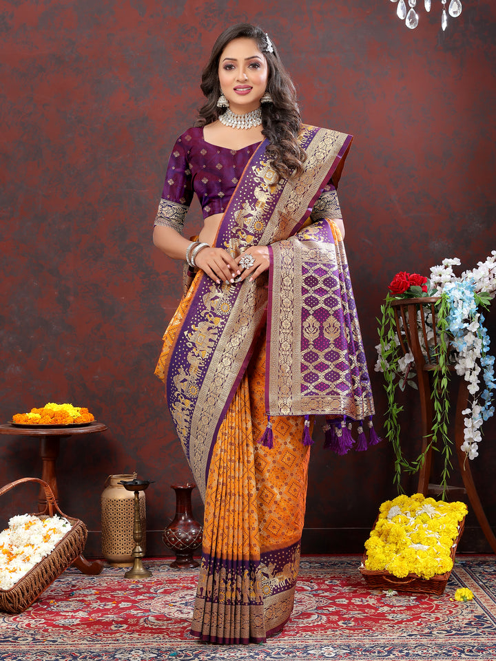 Mustard yellow Patola silk saree with intricate Meenakari weaving and a zari border, perfect for weddings and special events.