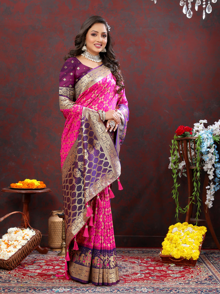 Soft pink silk saree featuring Meenakari motifs and a zari border, ideal for traditional celebrations and special events.