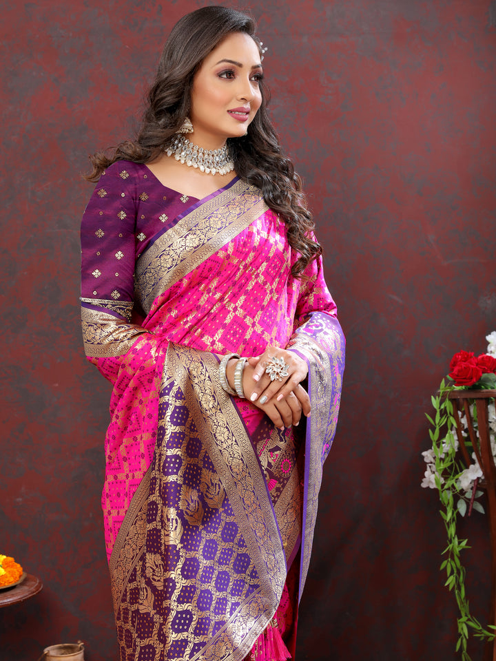 Gorgeous pink Patola silk saree with rich Meenakari weaving and zari detailing, perfect for festive occasions.