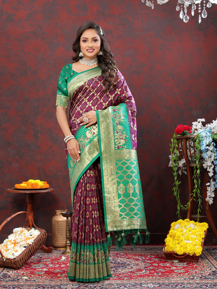 Beautiful pink Patola silk saree with intricate Meenakari work and a zari border, perfect for celebrations.