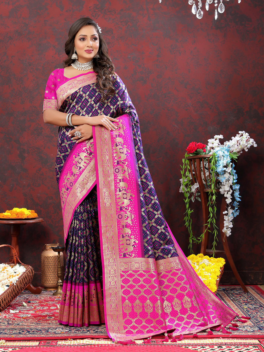 Stunning wine Patola silk saree with intricate Meenakari motifs and a zari border, perfect for cultural functions.