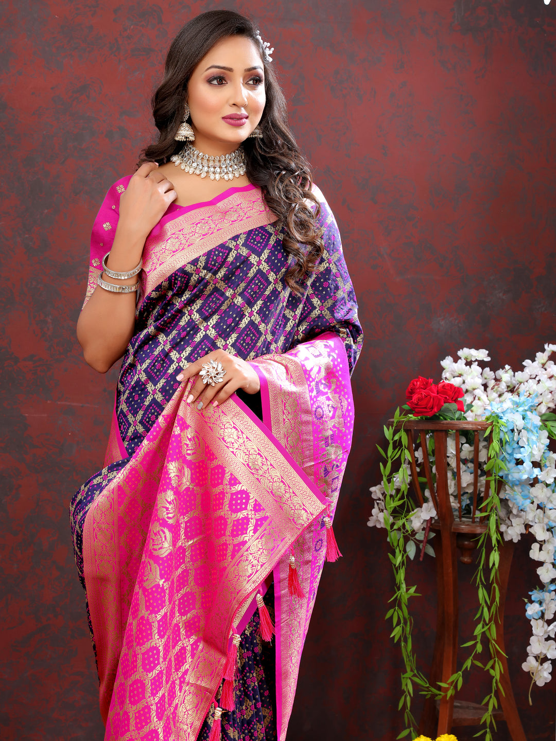 Elegant purple Patola silk saree featuring Meenakari weaving and a rich zari border, perfect for weddings and festive events.