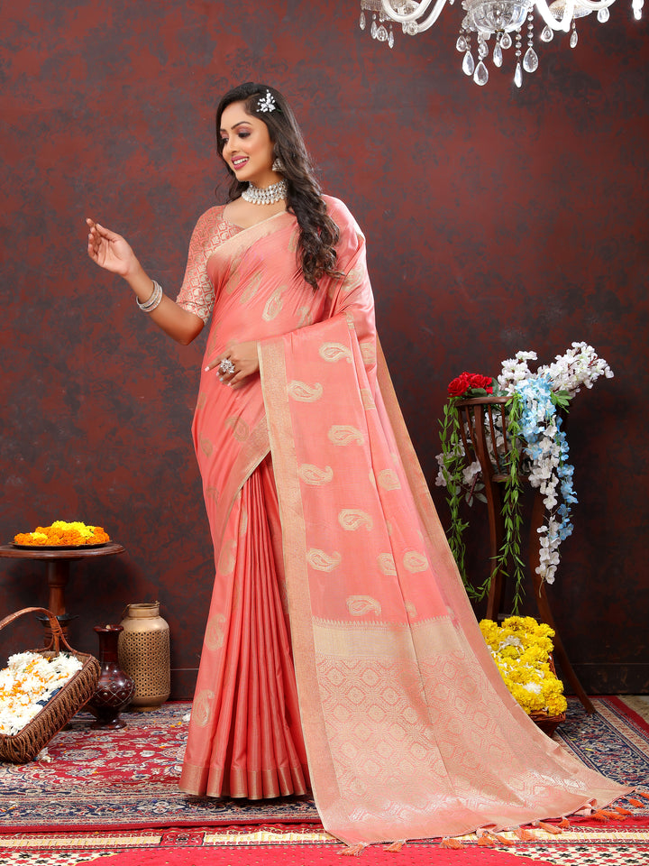 Beautiful peach cotton saree featuring delicate zari weaving and tassels at the pallu, perfect for weddings.