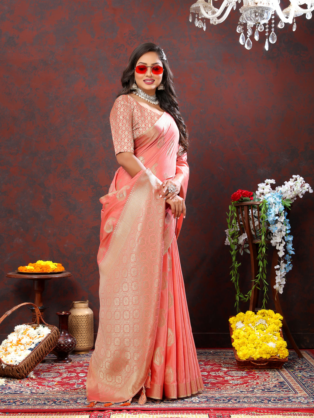 Soft peach cotton saree with zari weaving and elegant tassels at the pallu, perfect for cultural celebrations.