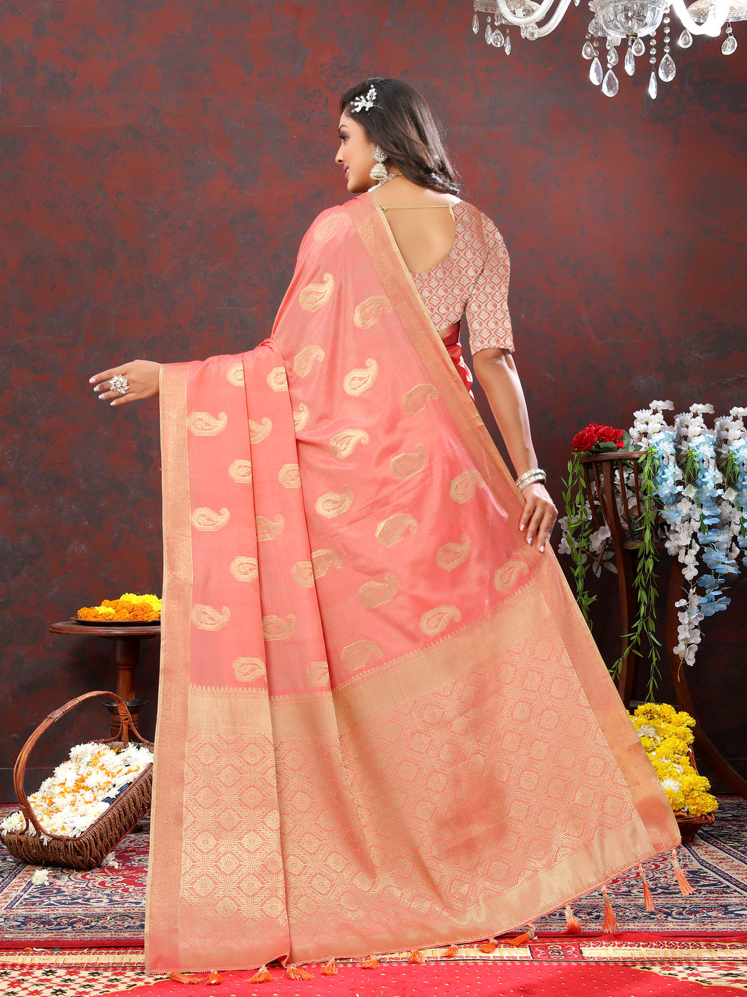 Graceful peach cotton saree with zari weaving and tassels at the pallu, perfect for elegant occasions.