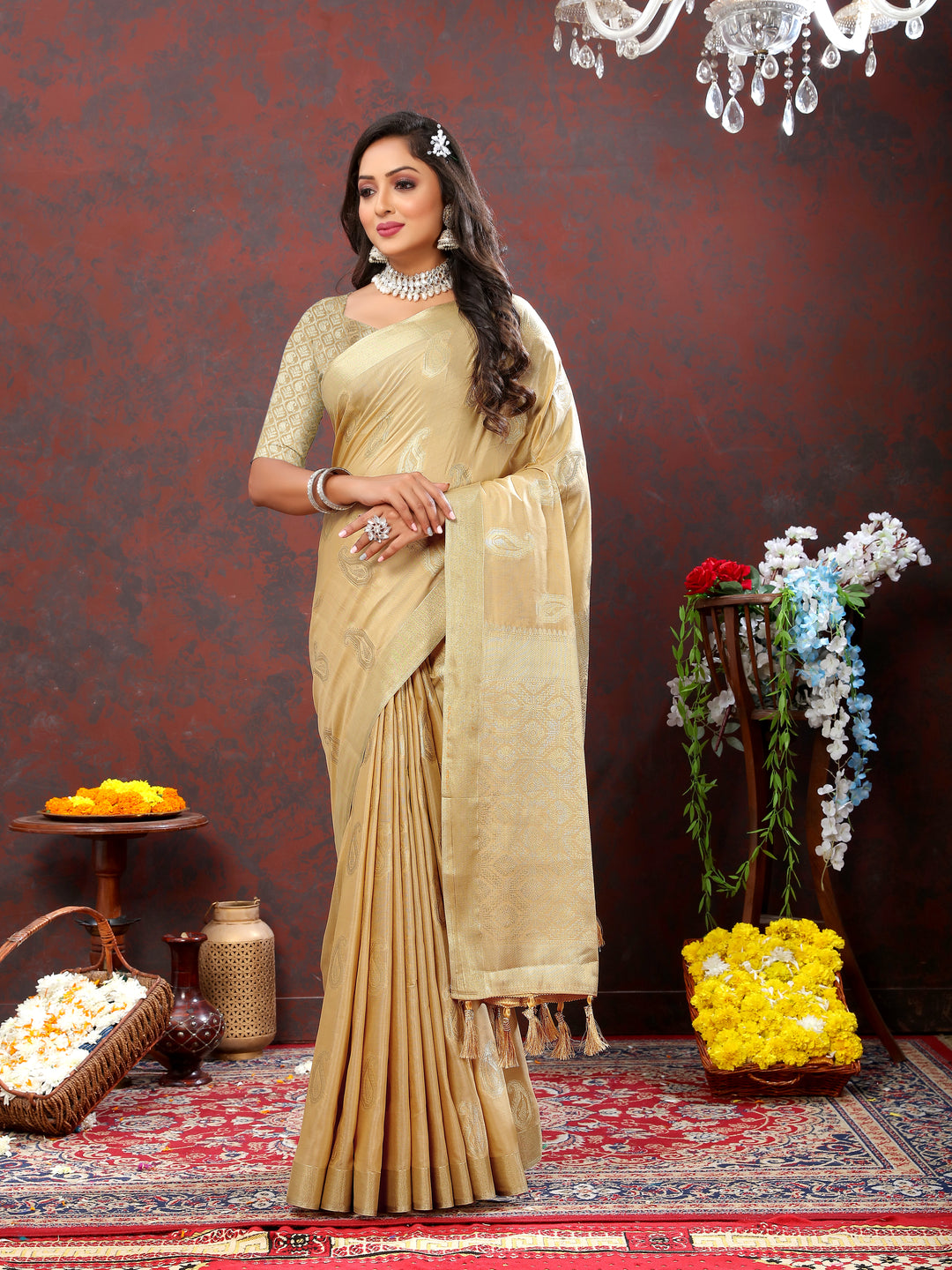 Classic beige cotton saree with beautiful zari weaving and tassels at the pallu, ideal for weddings.