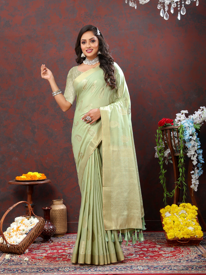 Stunning pista green cotton saree with intricate zari weaving and tassels at the pallu, perfect for weddings.