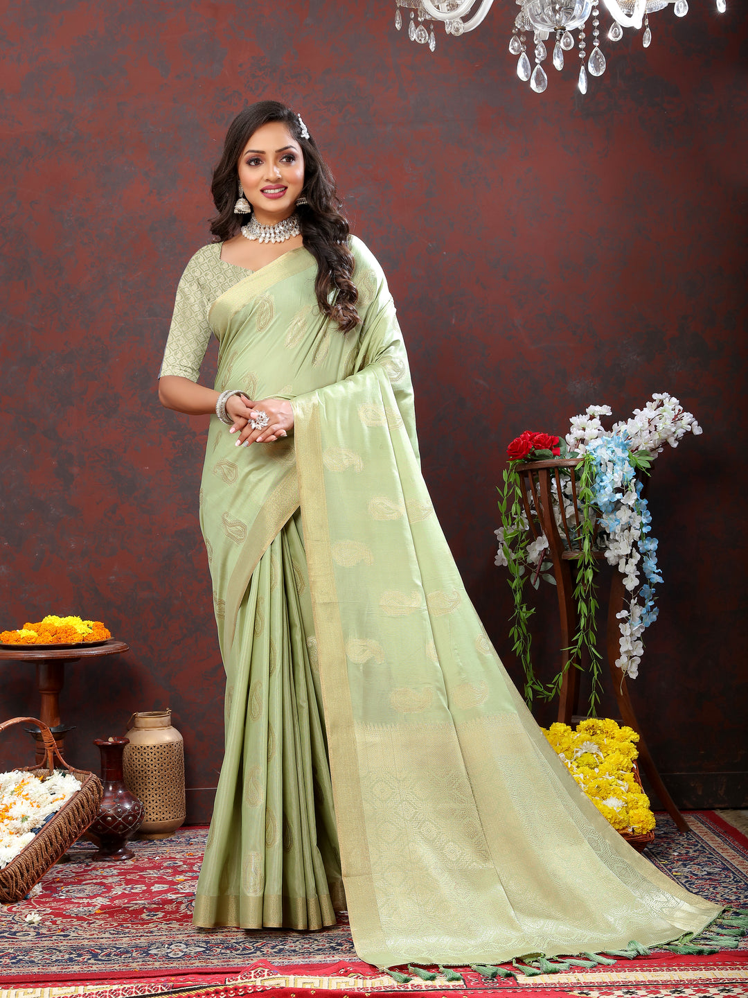 Graceful pista green saree featuring beautiful zari weaving and tassels at the pallu, ideal for festive occasions.