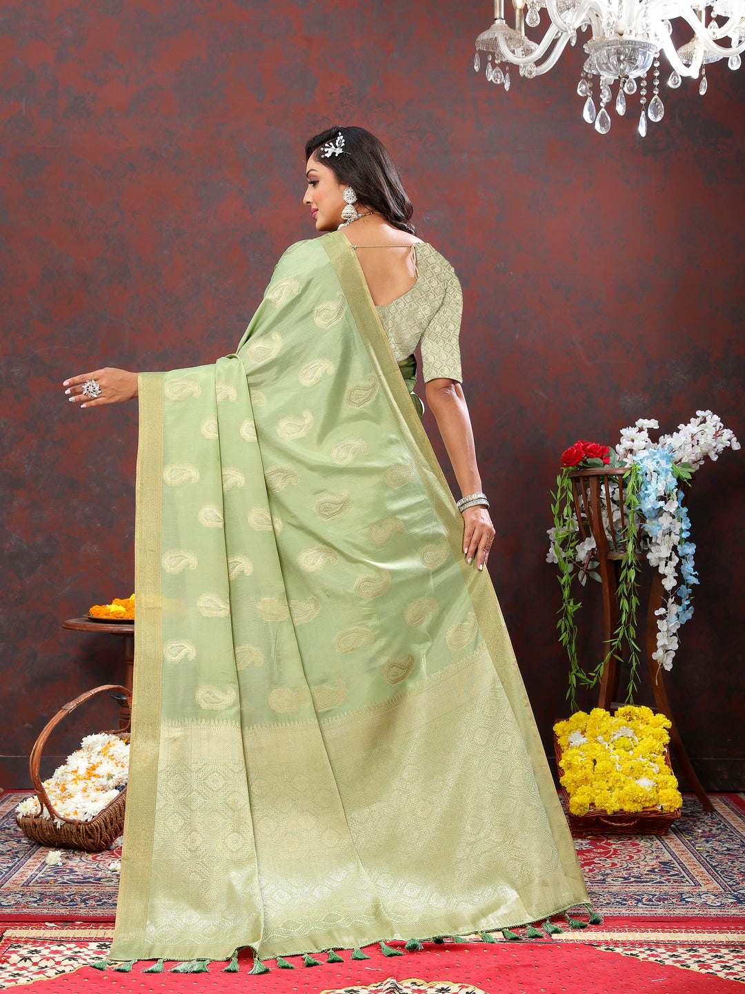 Timeless pista green saree with intricate zari weaving and tassels at the pallu, ideal for special events.