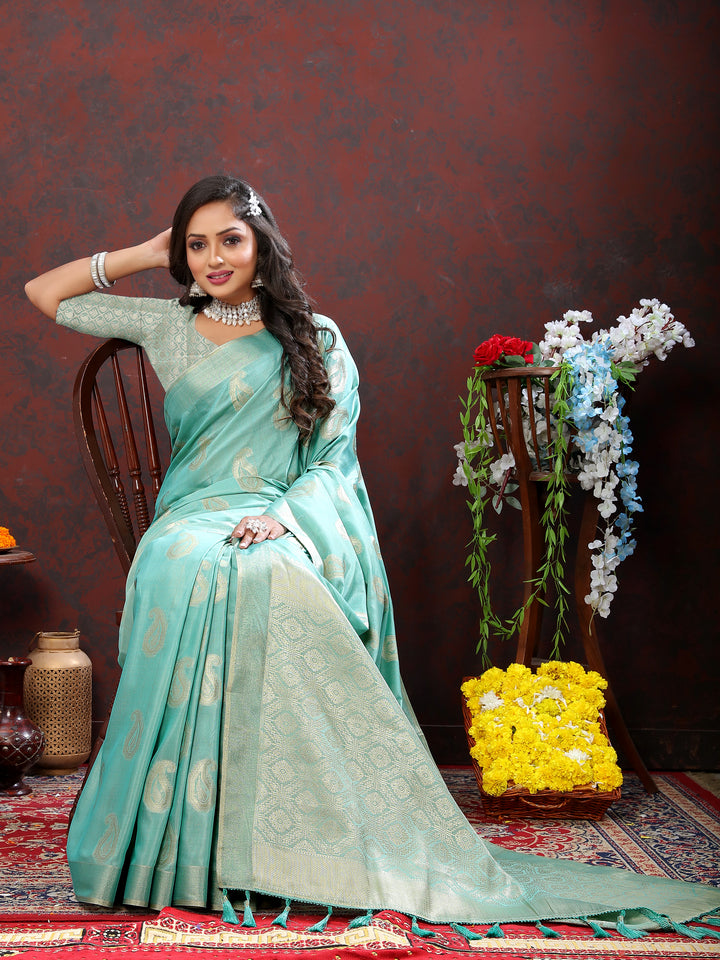 Graceful sky blue saree with delicate zari work and tassels at the pallu, ideal for festive occasions.