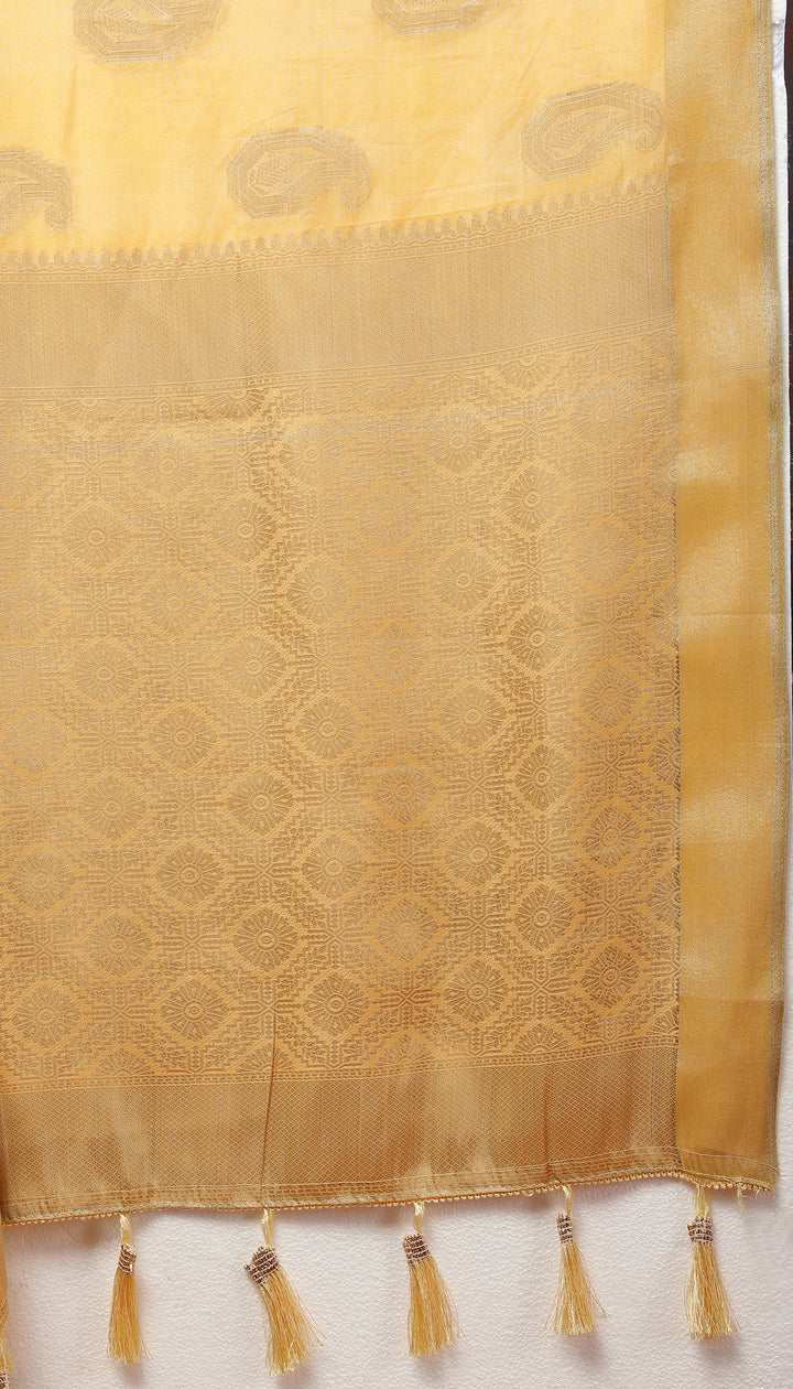 Stunning yellow cotton saree with zari work and tassels at the pallu, perfect for elegant gatherings.