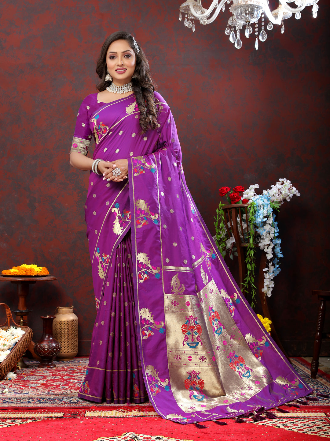 Elegant purple Paithani silk saree featuring gold zari motifs and Meenakari border, perfect for grand occasions.