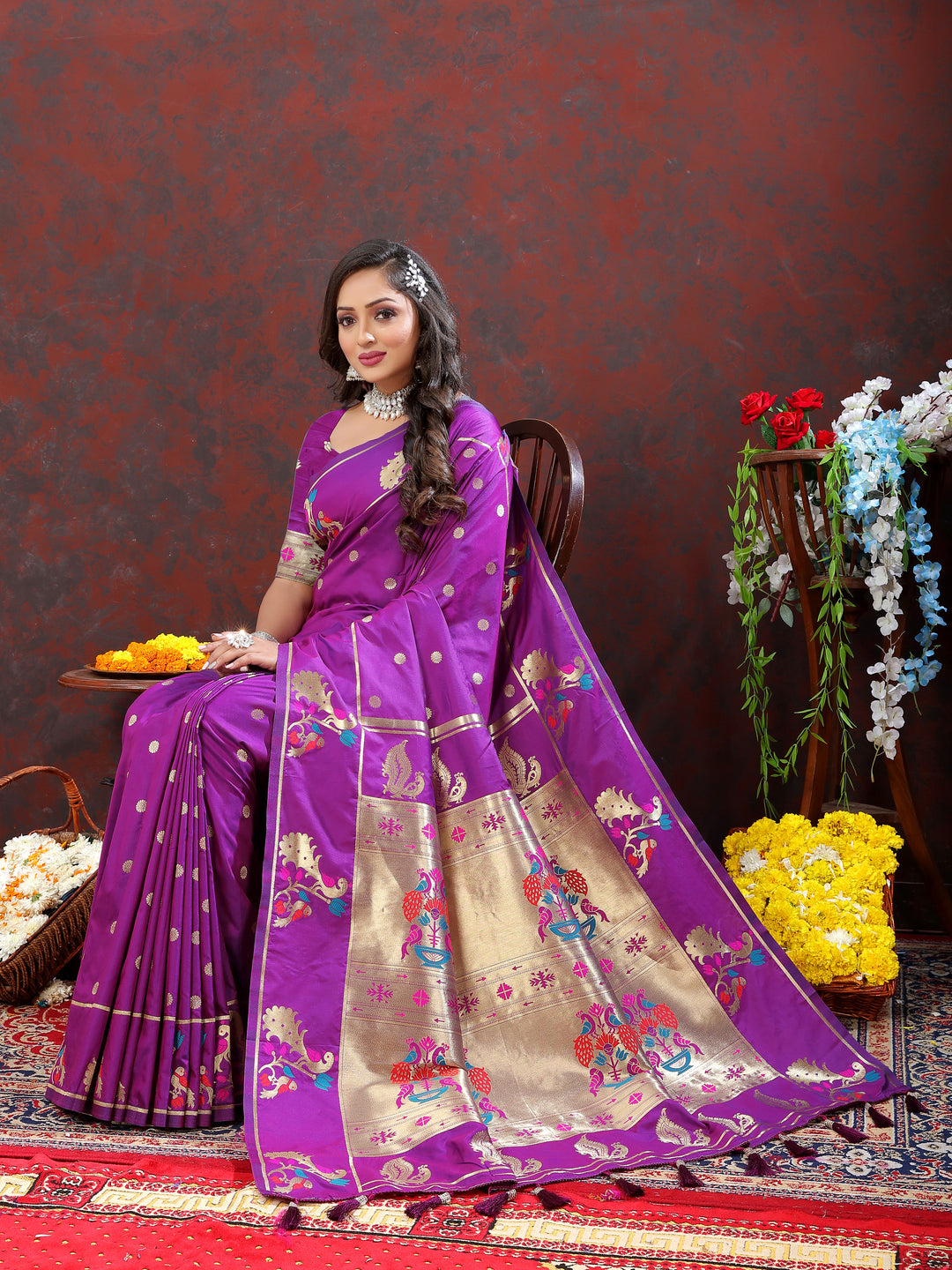 Traditional purple Paithani silk saree with gold zari motifs and Meenakari border for cultural events.