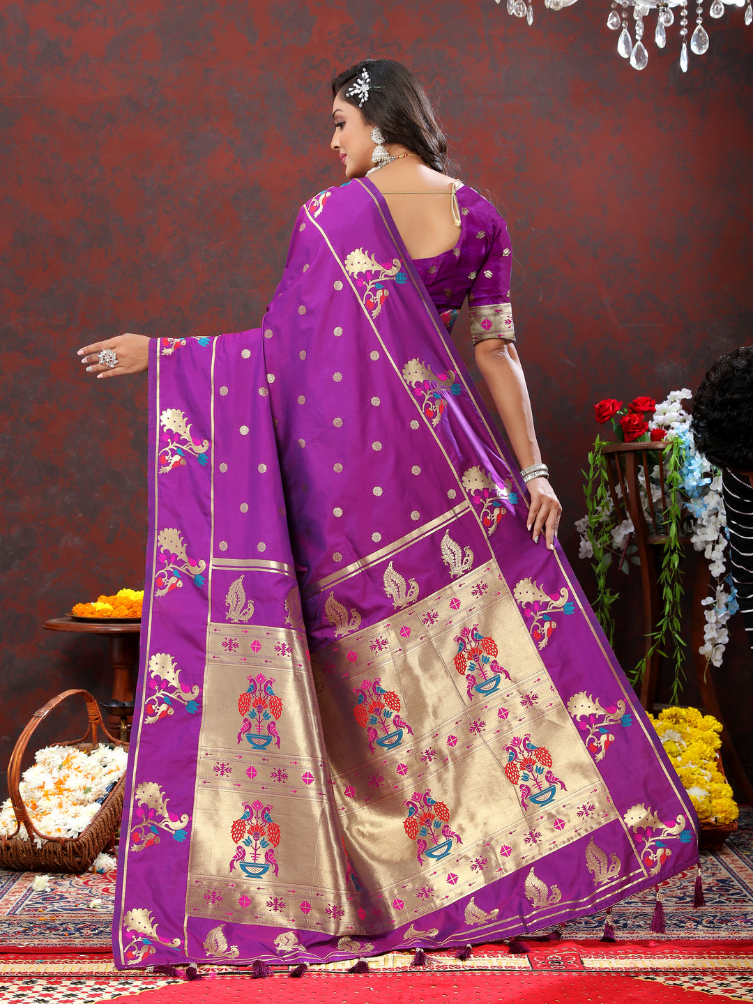 Stunning purple Paithani silk saree featuring gold zari motifs and Meenakari border for weddings.