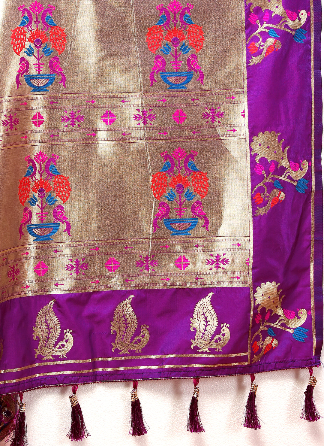 Magenta Paithani silk saree with gold zari motifs and Meenakari border, perfect for festive events.