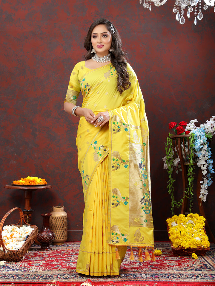 Timeless yellow Paithani silk saree with gold zari motifs and Meenakari border, perfect for weddings.