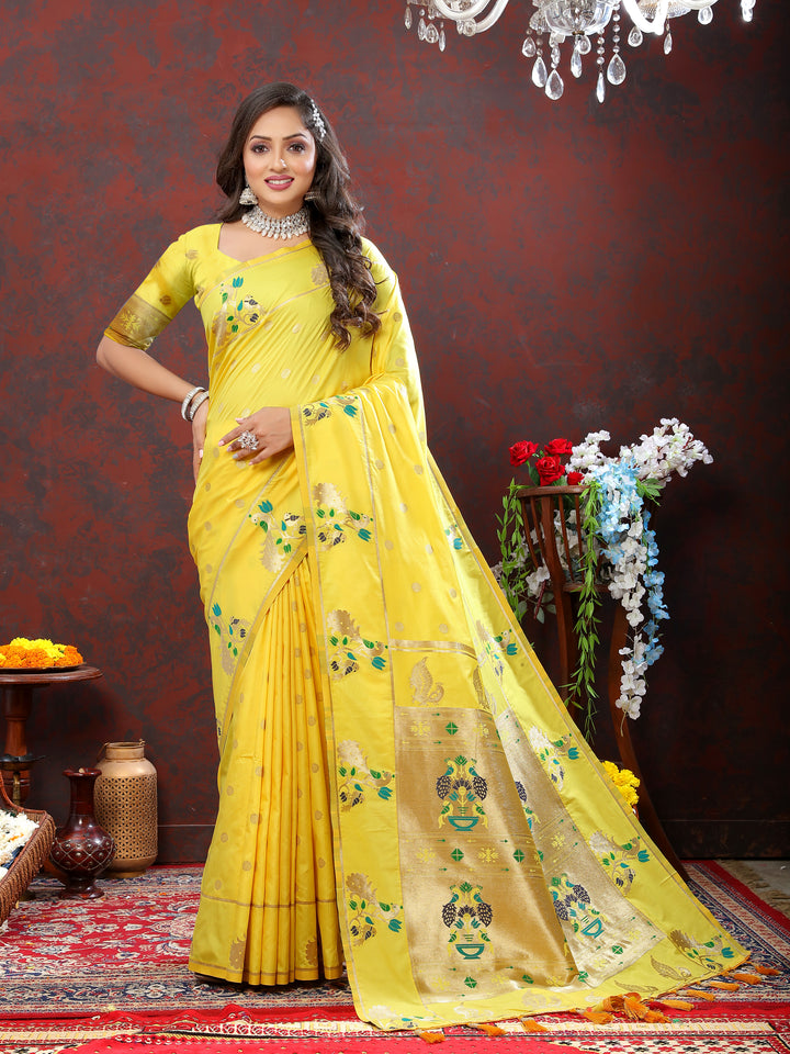 Stunning yellow Paithani silk saree featuring gold zari motifs and Meenakari border for cultural celebrations.