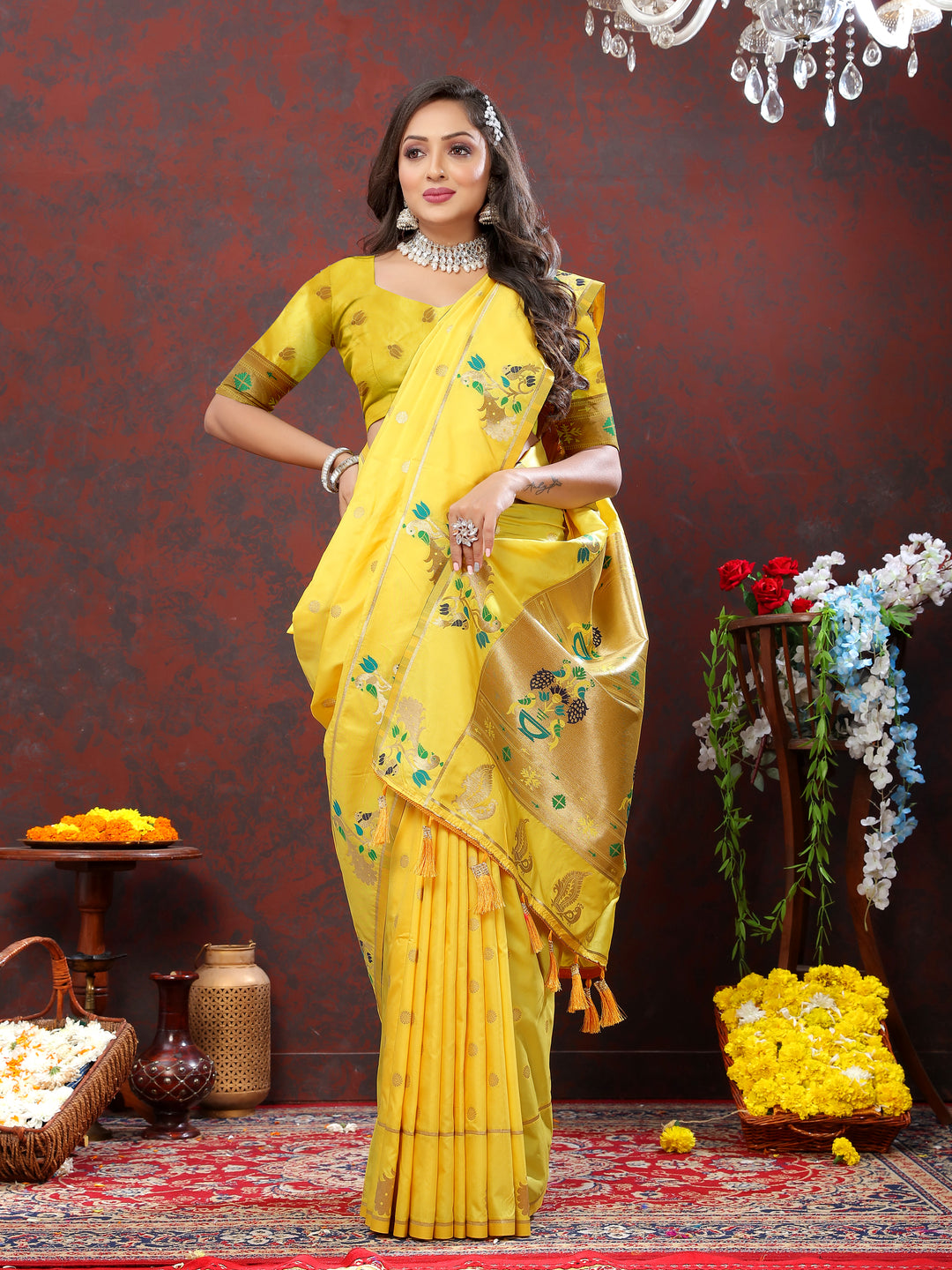 Traditional yellow Paithani silk saree with gold zari motifs and Meenakari border, ideal for festive gatherings.