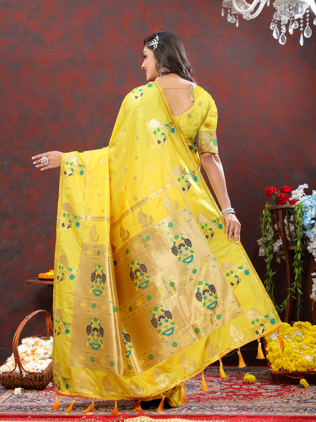 Classic deep yellow Paithani silk saree with gold zari detailing and Meenakari border for festive celebrations.