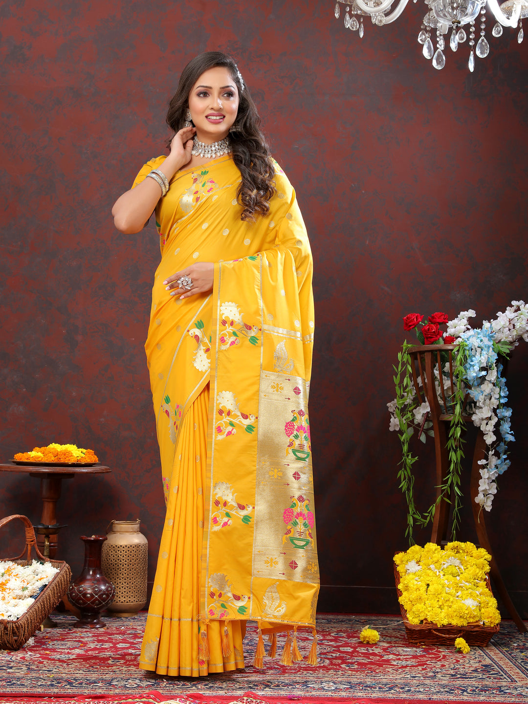 Stunning deep yellow Paithani silk saree with gold zari motifs and Meenakari border for cultural events.