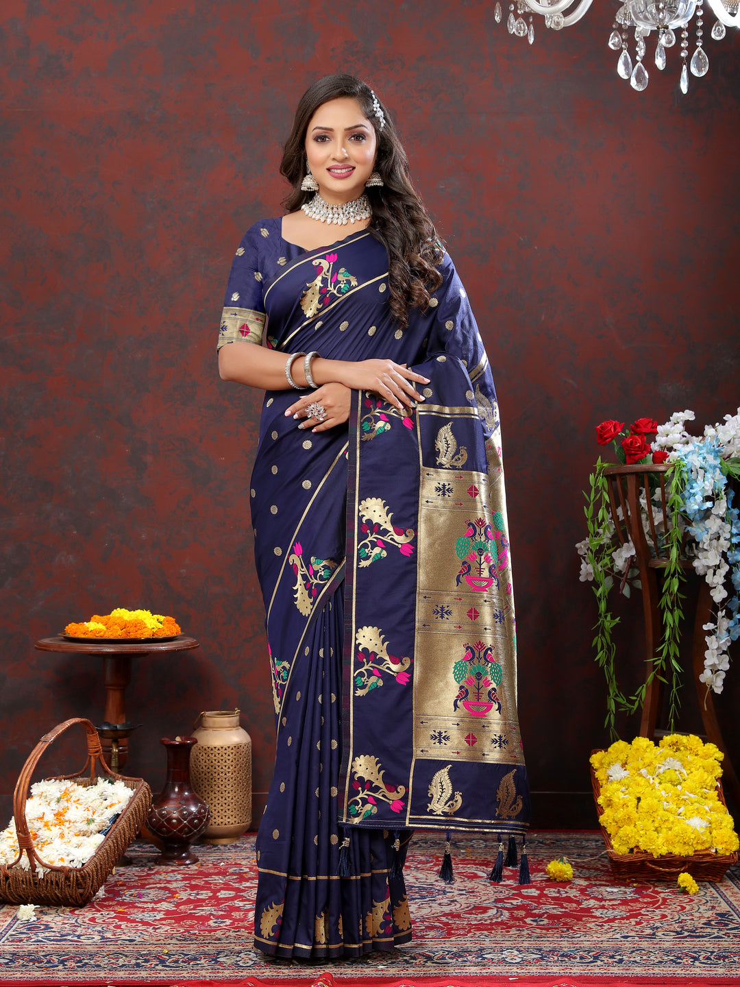 Bright pink Paithani silk saree featuring gold zari motifs and Meenakari border, ideal for grand celebrations.