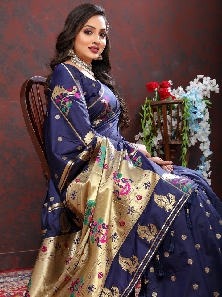 Traditional bright pink Paithani silk saree with gold zari motifs and Meenakari border for cultural events.