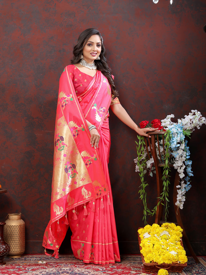 Stunning pink Paithani silk saree with gold zari motifs and Meenakari border for cultural celebrations.