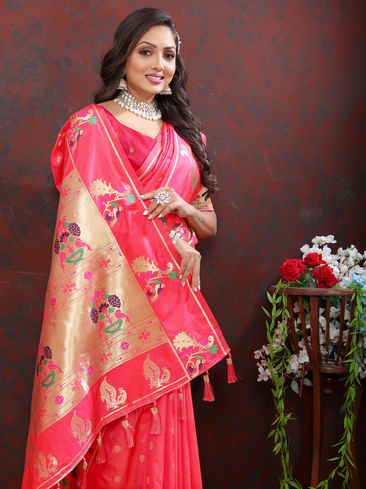 Traditional pink Paithani silk saree with gold zari motifs and Meenakari border, ideal for festive gatherings.