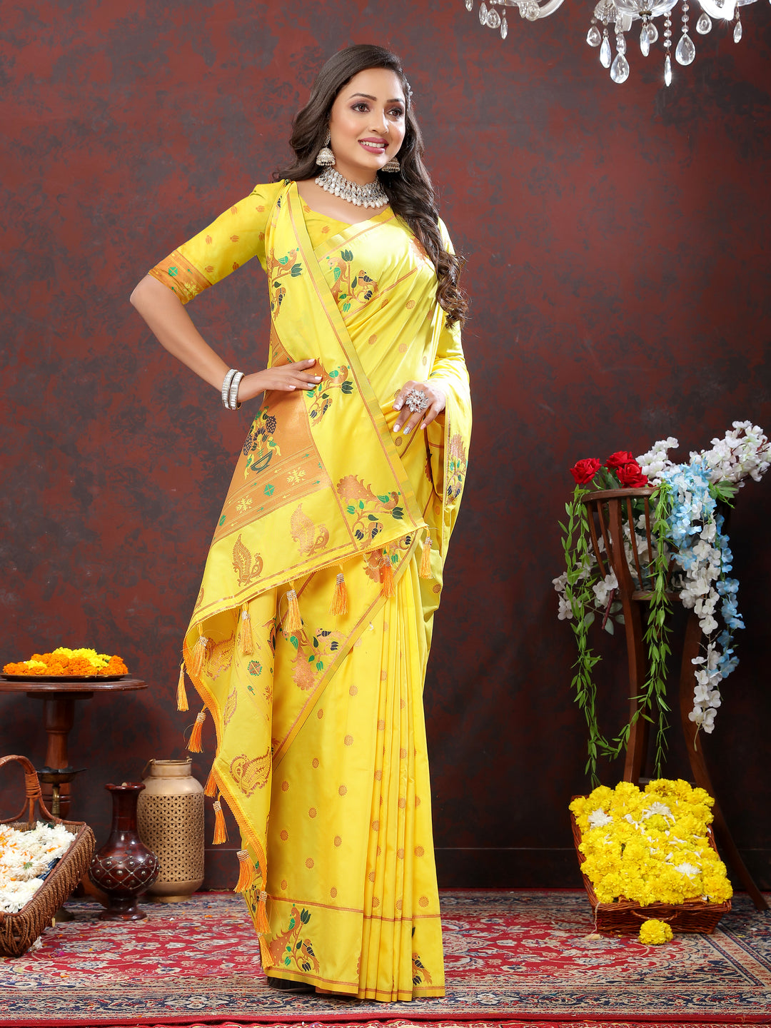 Bright yellow Paithani silk saree with intricate copper zari work and Meenakari border for festive occasions.