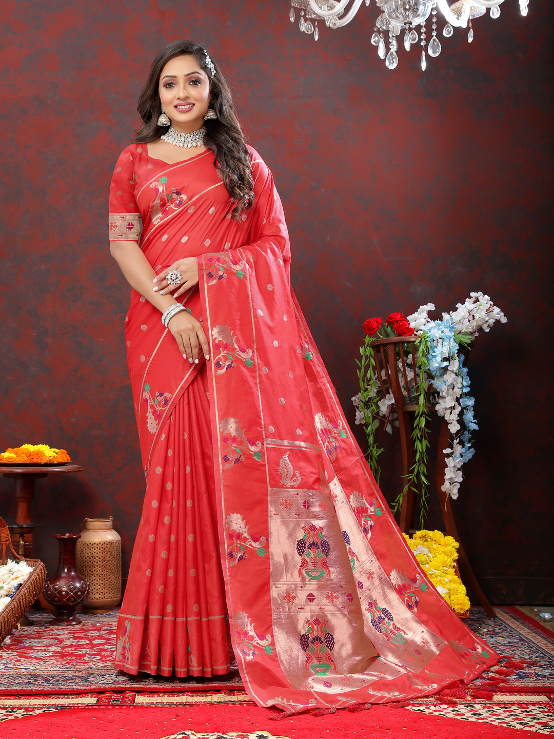 Classic red Paithani silk saree featuring copper zari motifs and Meenakari border for grand occasions.