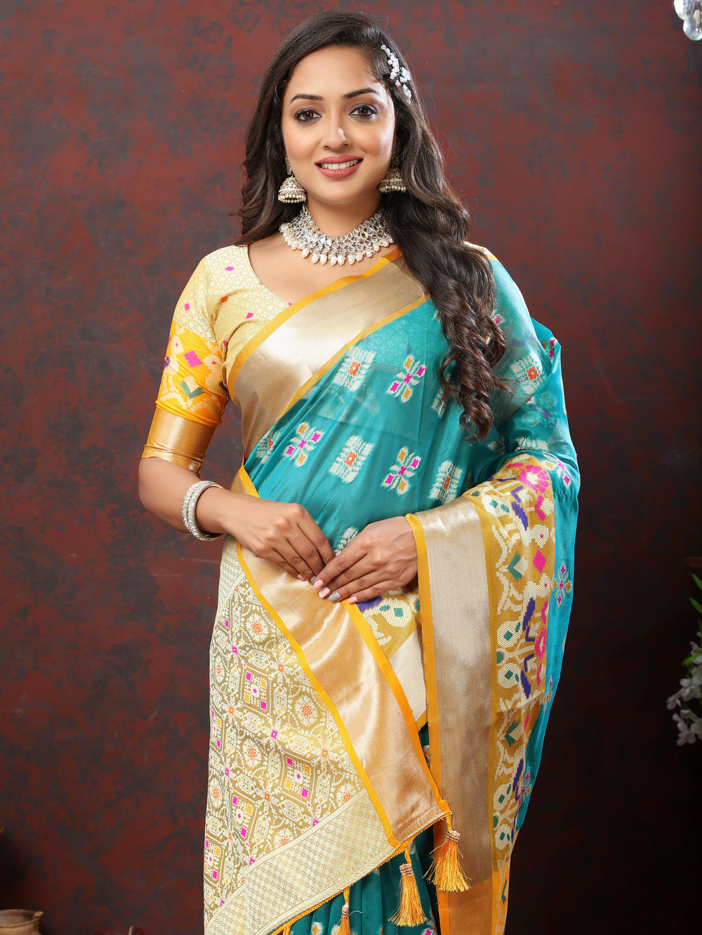 Sky blue saree with luxurious Meenakari work and a matching silk blouse piece.