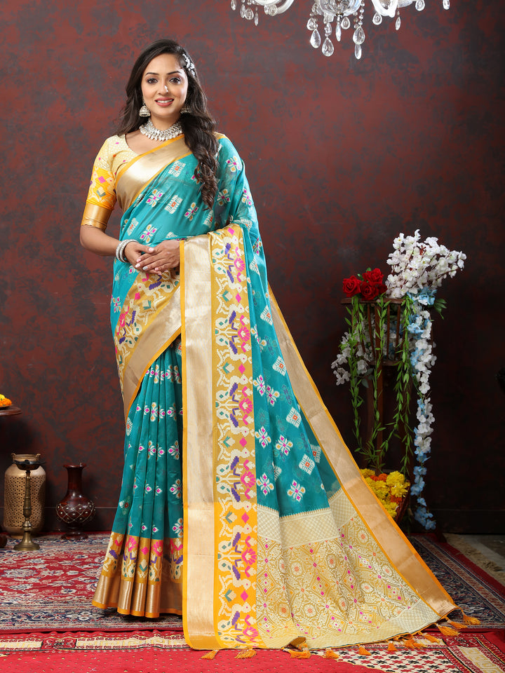 Sky blue saree with rich Meenakari weaving, zari pallu, and tassel detailing.