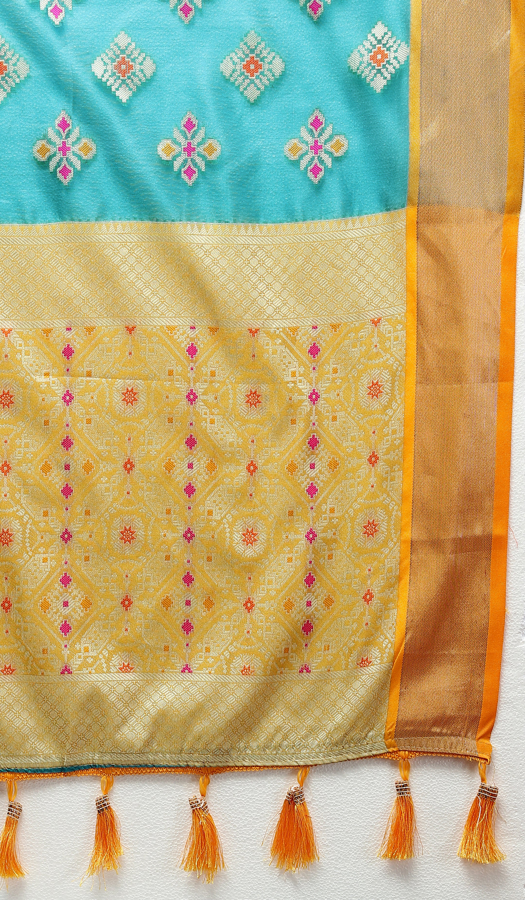 Sky blue silk saree with Meenakari motifs and a beautiful zari border, perfect for celebrations.