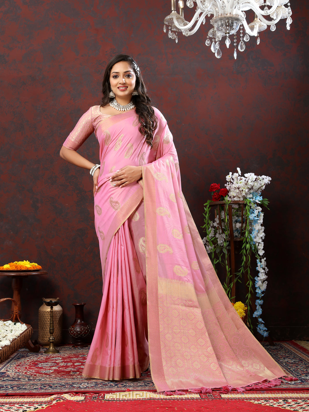 Beautiful pink cotton saree with intricate zari weaving and tassels at the pallu, perfect for weddings.