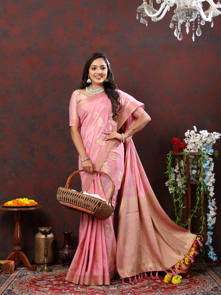 Graceful pink saree with delicate zari work and tassels at the pallu, ideal for festive occasions.