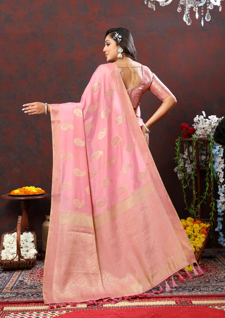 Timeless pink saree with beautiful zari work and tassels at the pallu, ideal for special events.