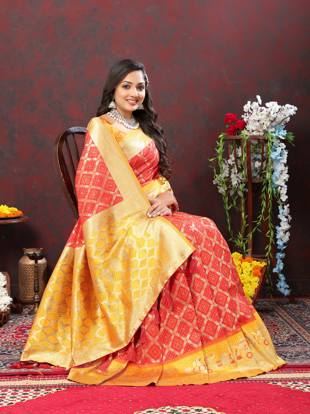 Olive Patola silk saree with Meenakari weaving and a zari border, designed for weddings and special events.