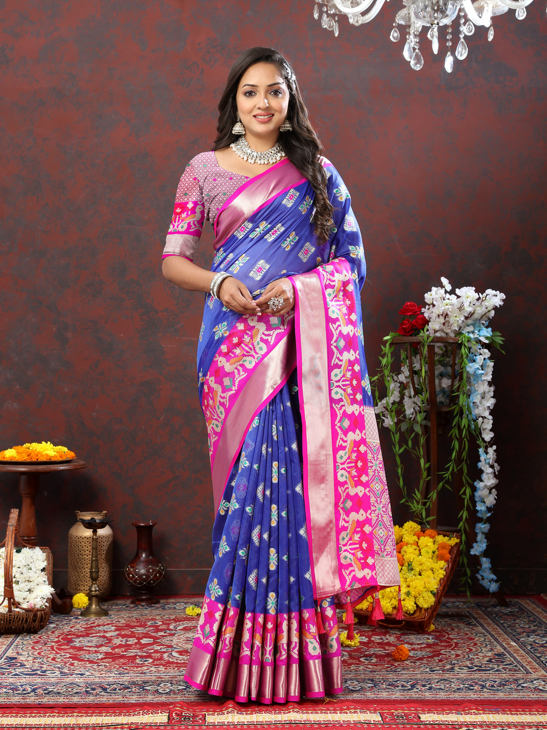 Elegant blue organza silk saree with rich zari pallu and contrasting border.