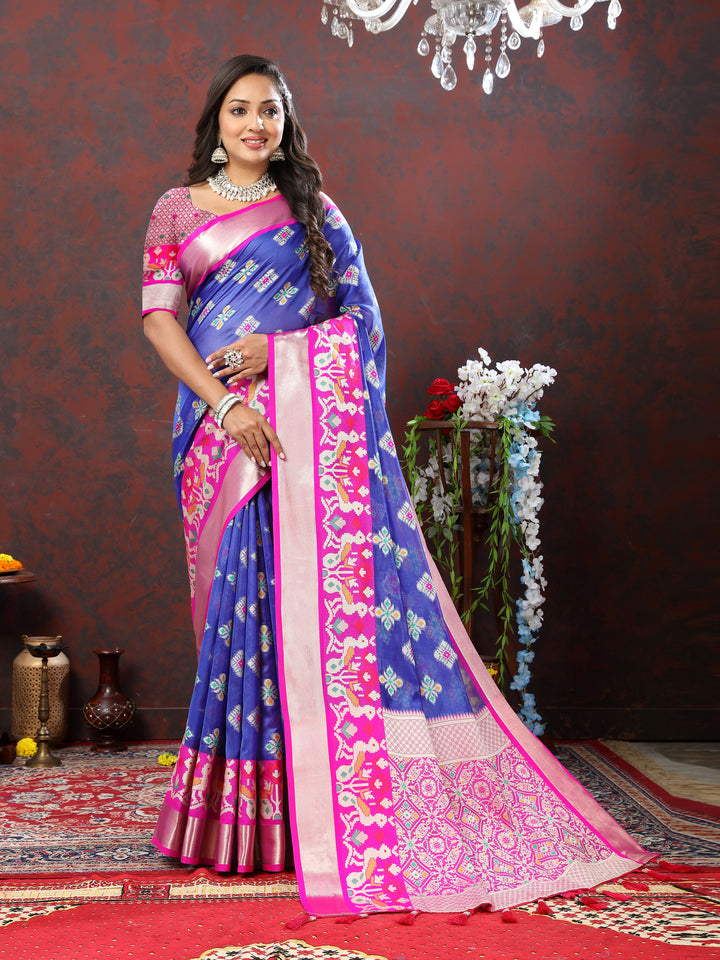 Blue organza silk saree featuring Meenakari motifs and tasseled pallu.