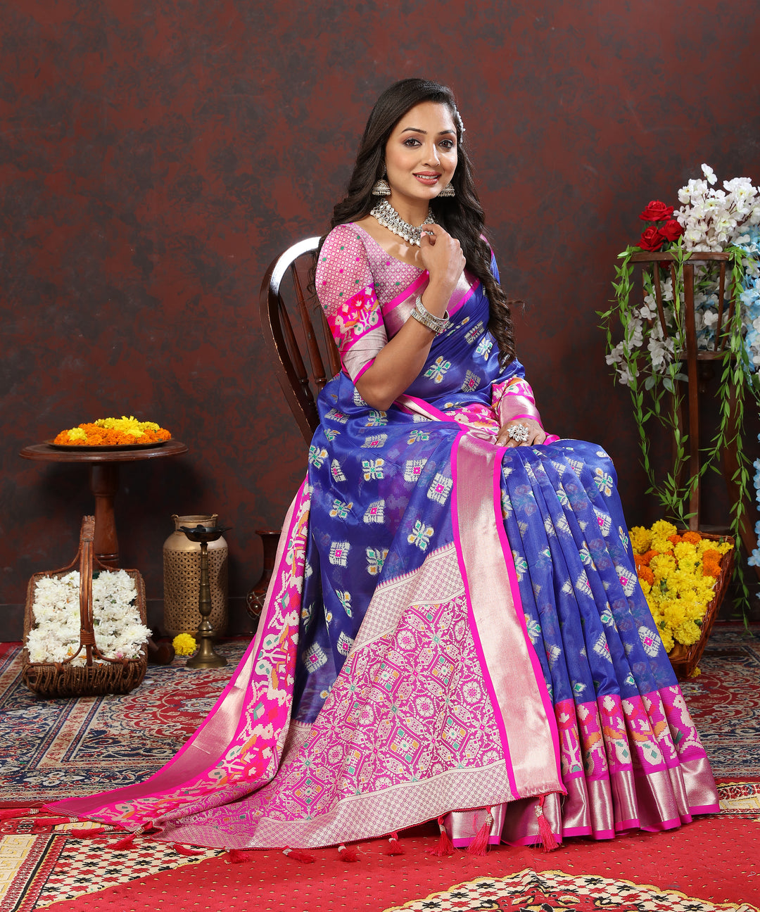 Blue saree with intricate zari weaving and a matching blouse piece for elegant wear.