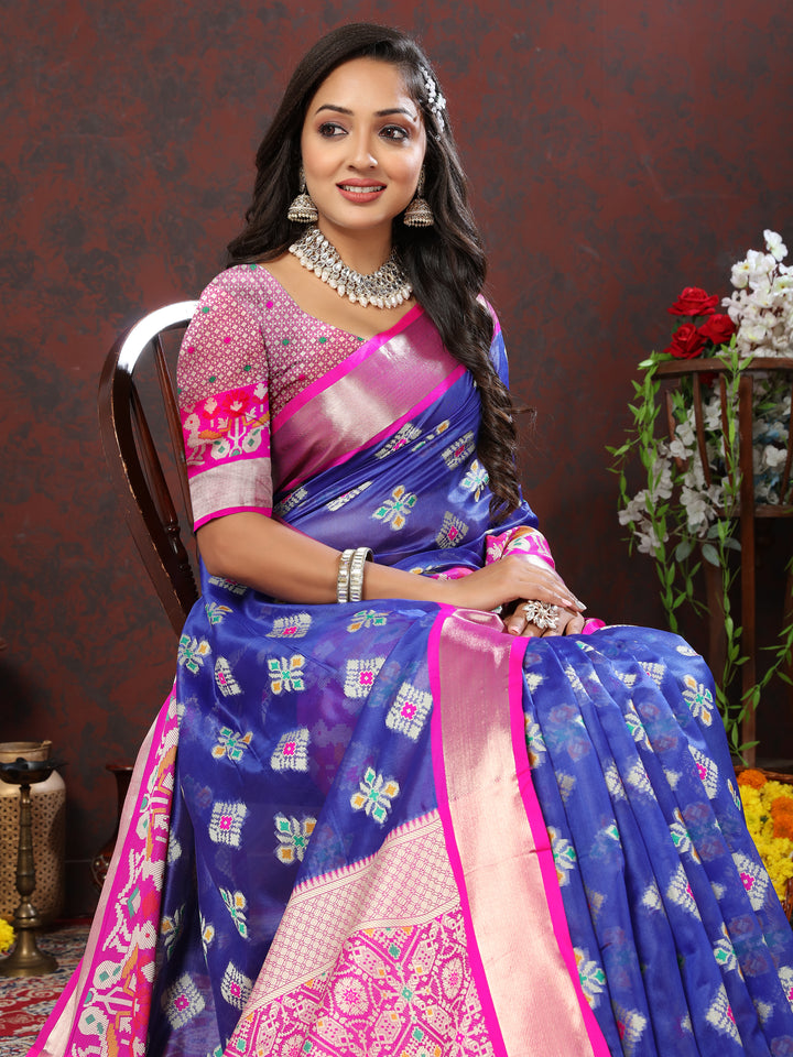 Blue silk saree with intricate Meenakari weaving, ideal for festive celebrations.