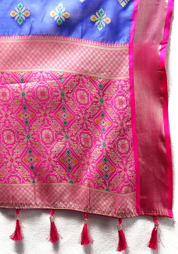 Blue organza saree with intricate Meenakari weaving, ideal for festive celebrations.