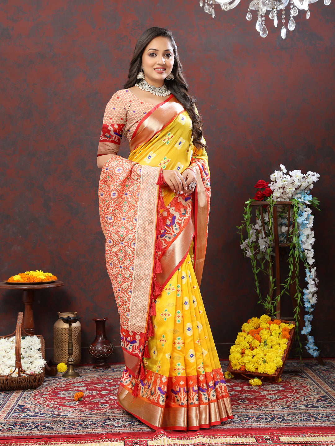 Yellow saree with Meenakari weaving and zari work, perfect for cultural events.