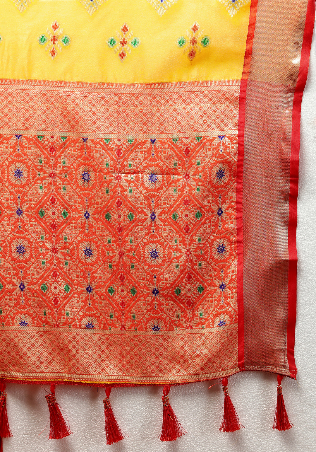 Yellow silk saree with zari pallu and Meenakari design, perfect for celebrations.