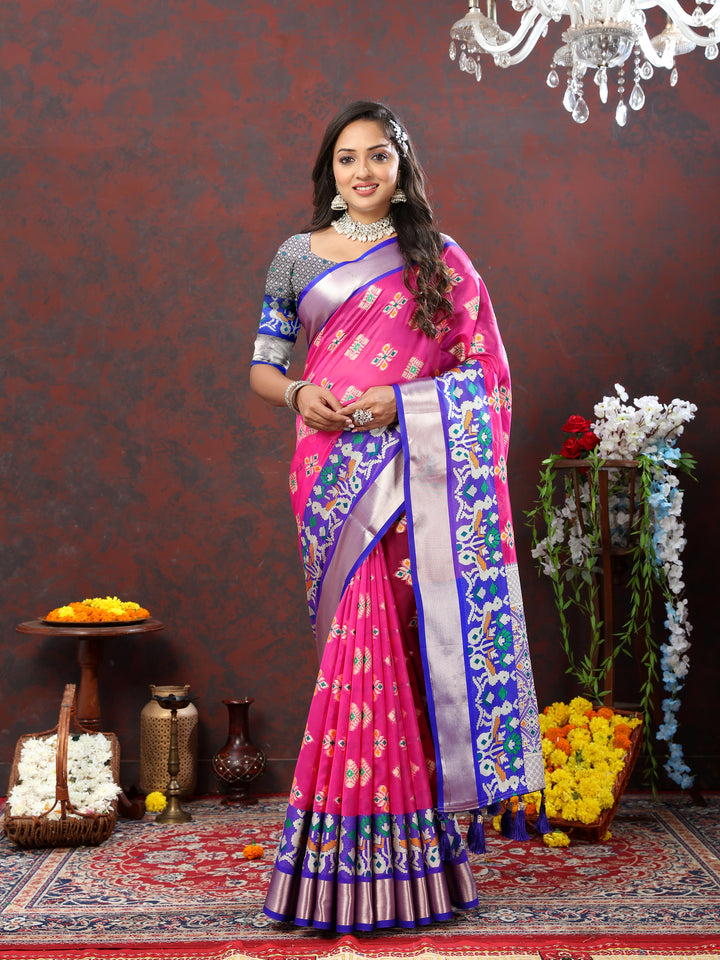 Graceful pink organza silk saree with intricate Meenakari design and zari pallu.