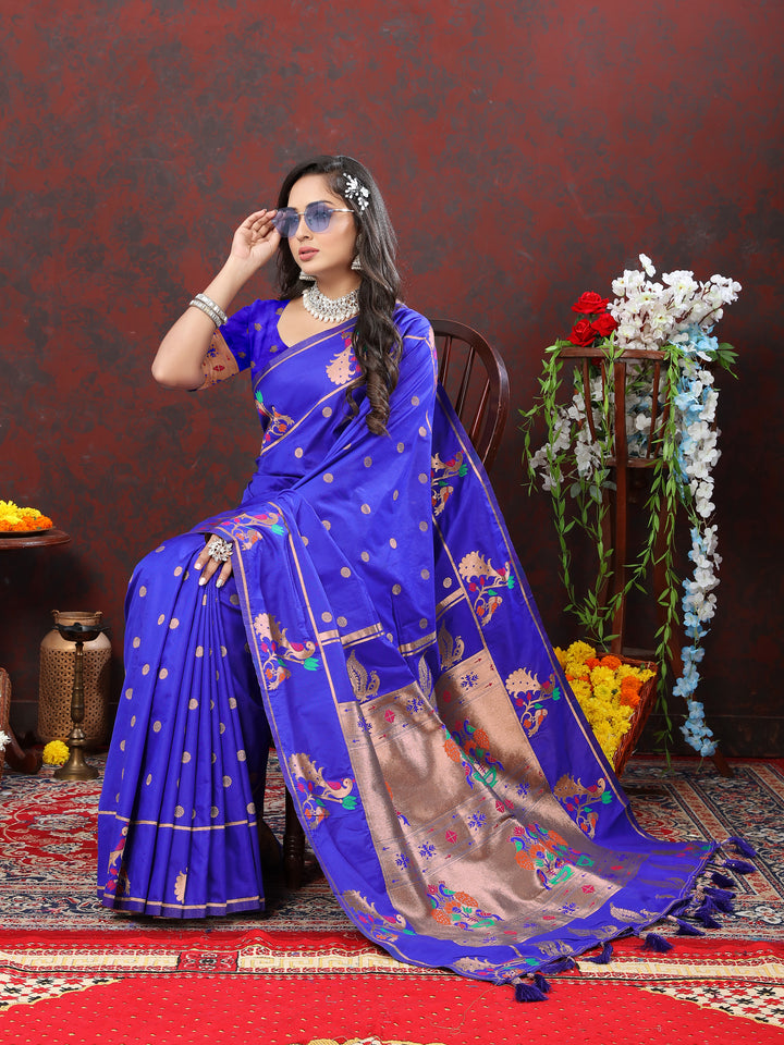 Beautiful blue Paithani silk saree featuring copper zari motifs and Meenakari border for cultural events.