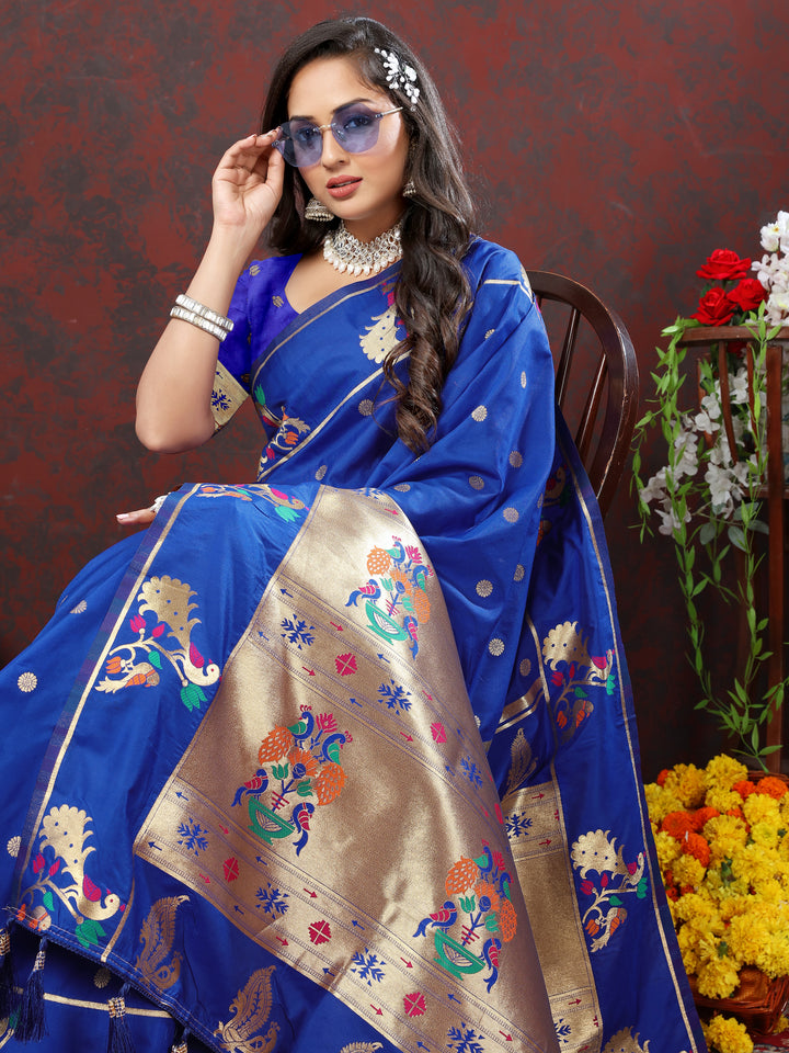 Designer dark blue Paithani silk saree with intricate gold zari motifs and Meenakari border for festive occasions.