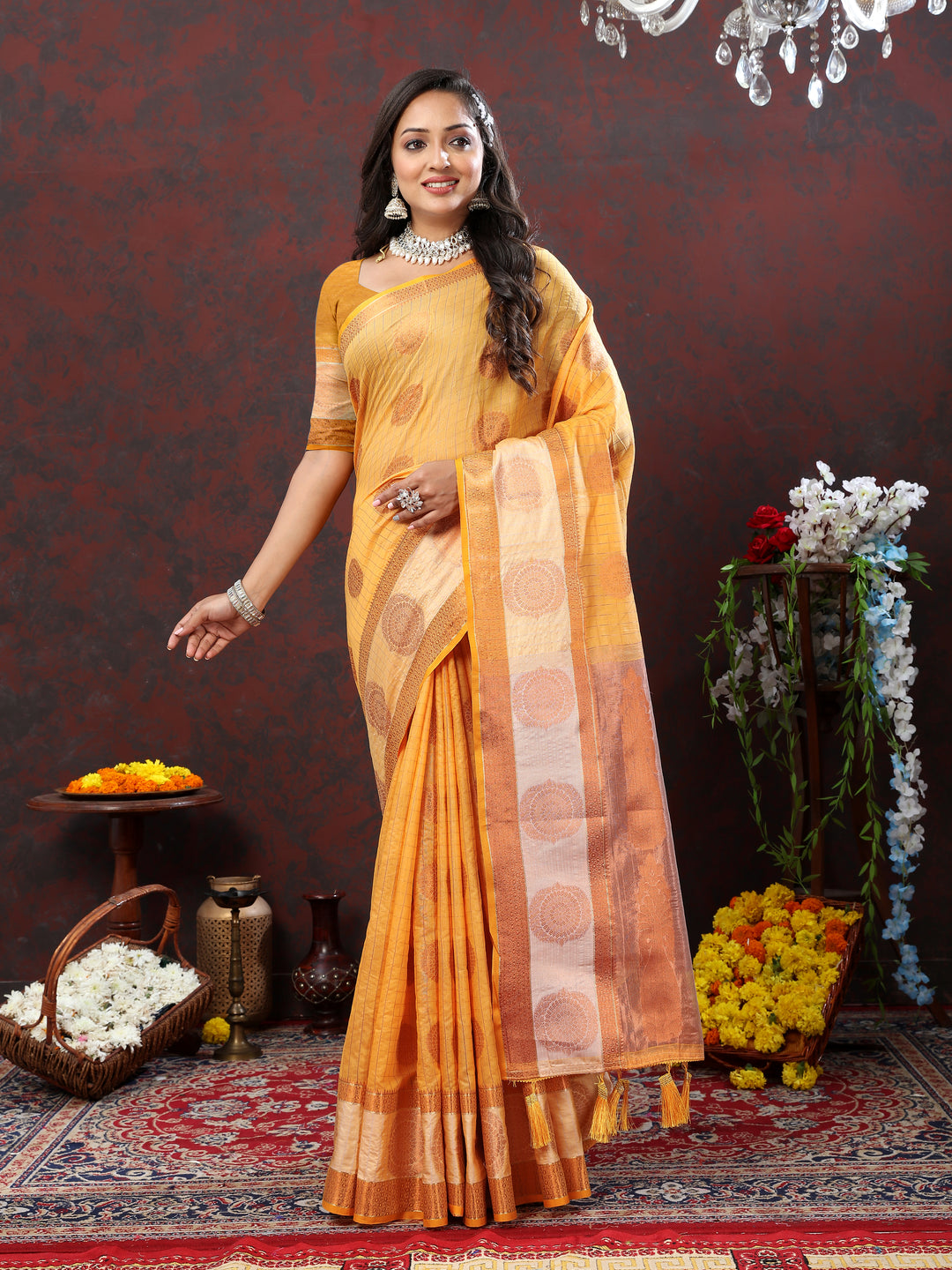 Elegant yellow saree with intricate zari work, perfect for traditional and cultural events.